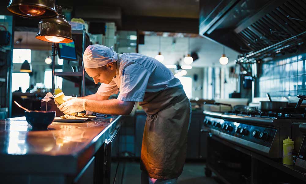 chef serving food at his restaurant