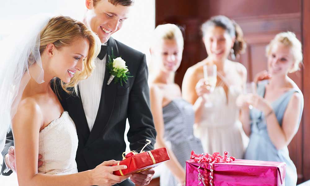 wedding couple opening gifts