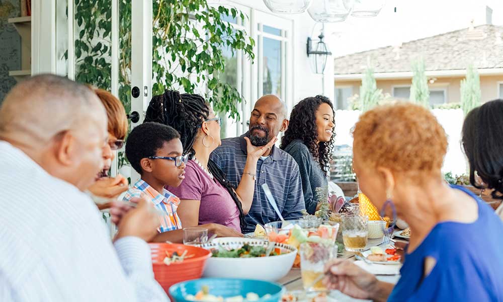 happy family enjoying food at table during party