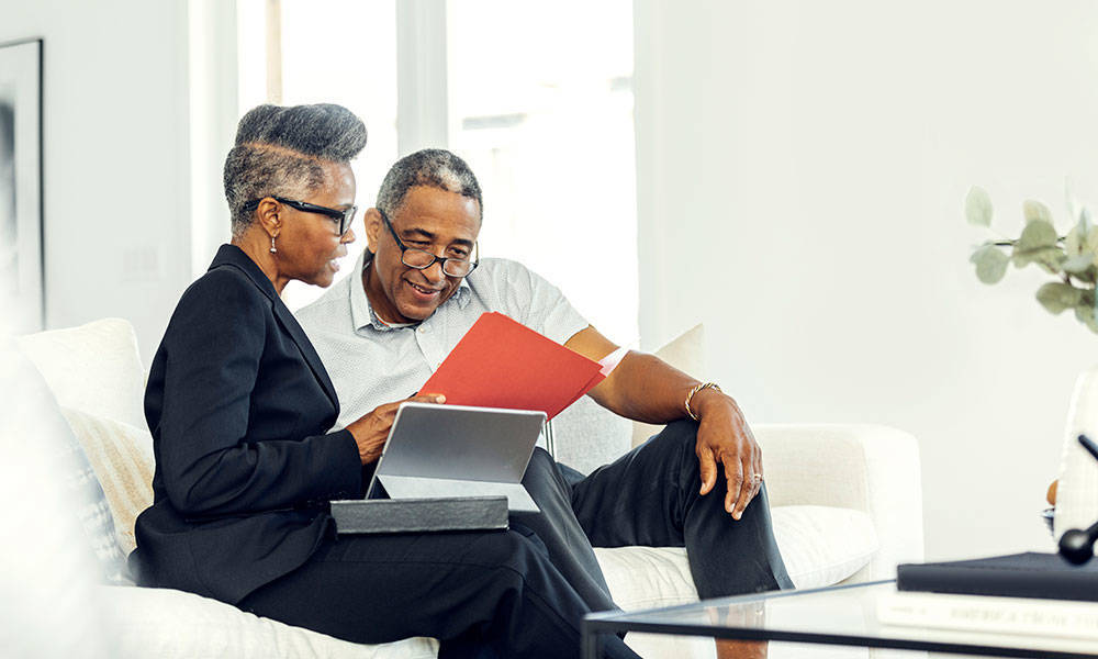 retirement-age man meeting with financial advisor
