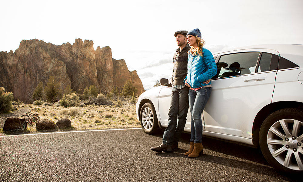couple taking road trip and looking at sights