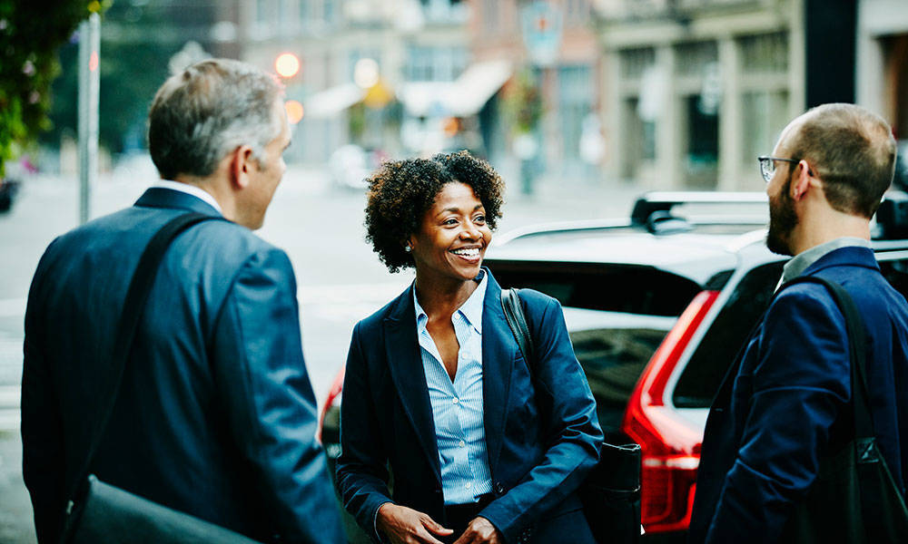 business people chatting outside