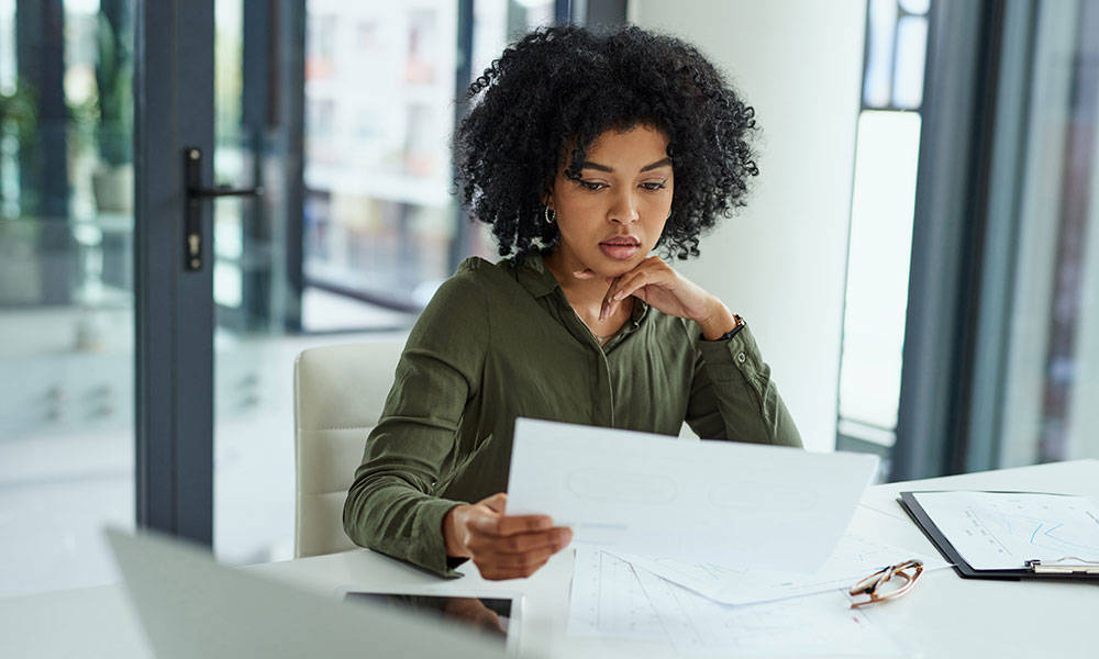 woman looking over her finances