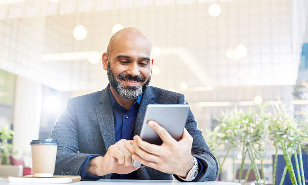 businessman using his tablet in an office