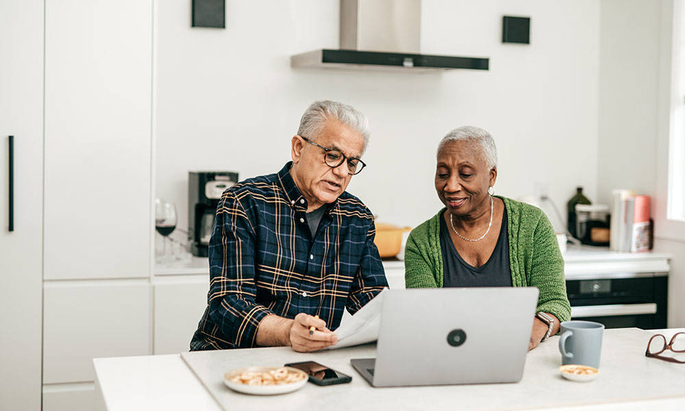 couple working together on laptop computer