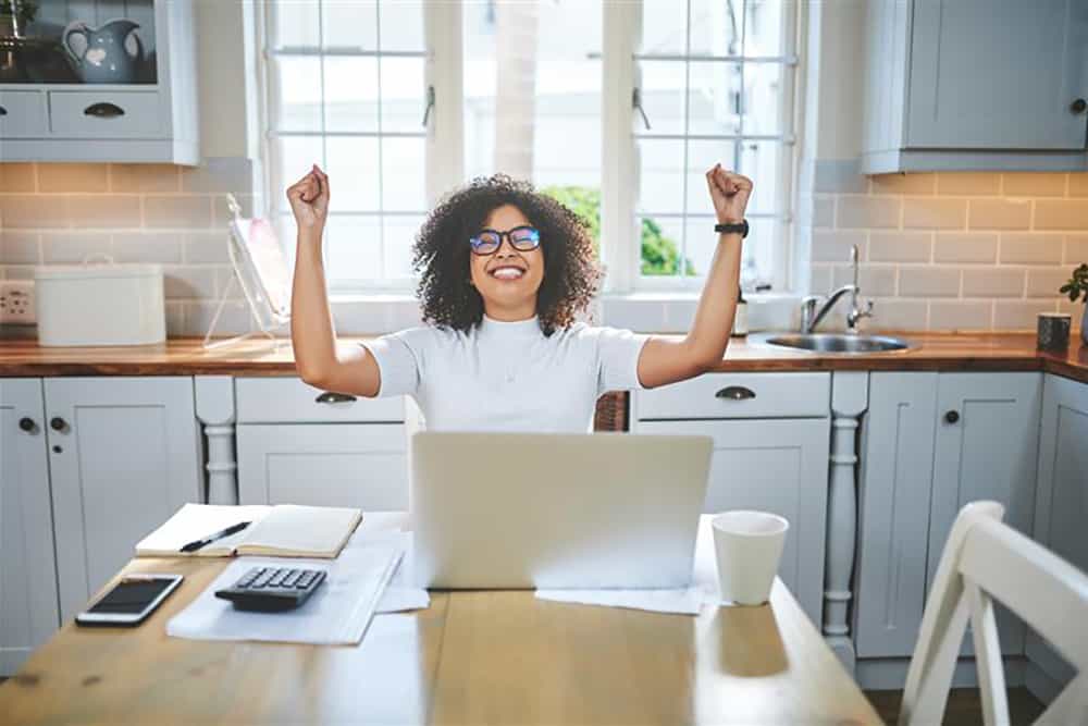 Investing 101 - Excited Woman Banking on Computer