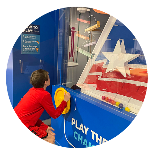 BizTown student playing savings game in CommunityAmerica branch.
